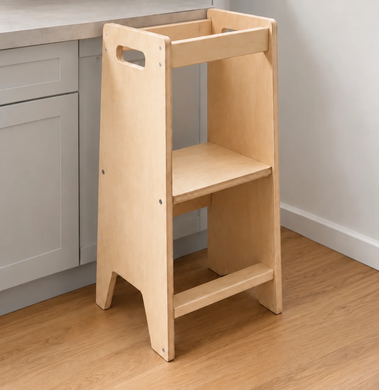 Natural plywood learning tower with an additional plank on the counter-facing side